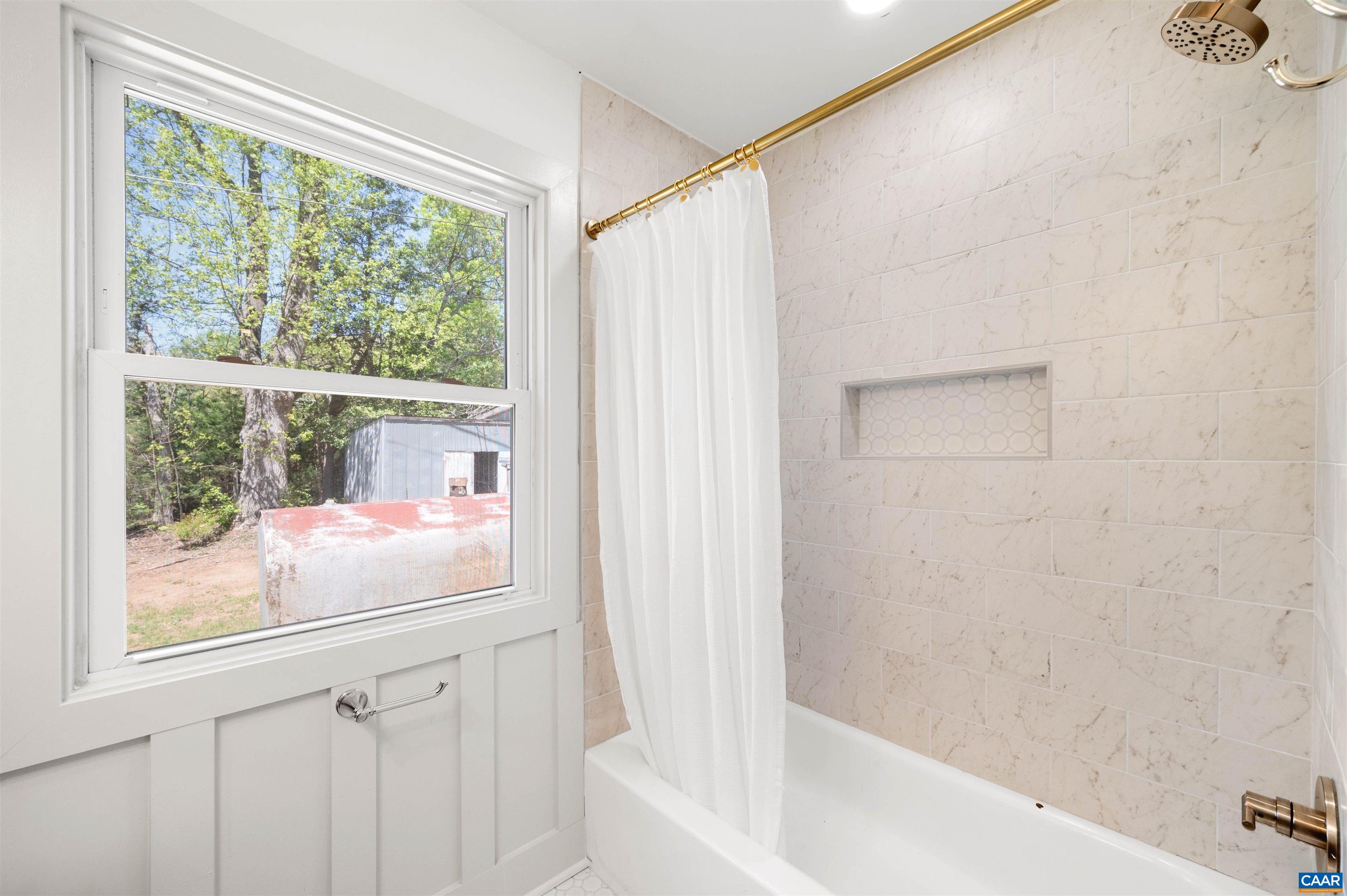 1867 Stage Junction Road Columbia, VA 23038 - Photo 32 of 46 a bathroom with a bathtub and a shower