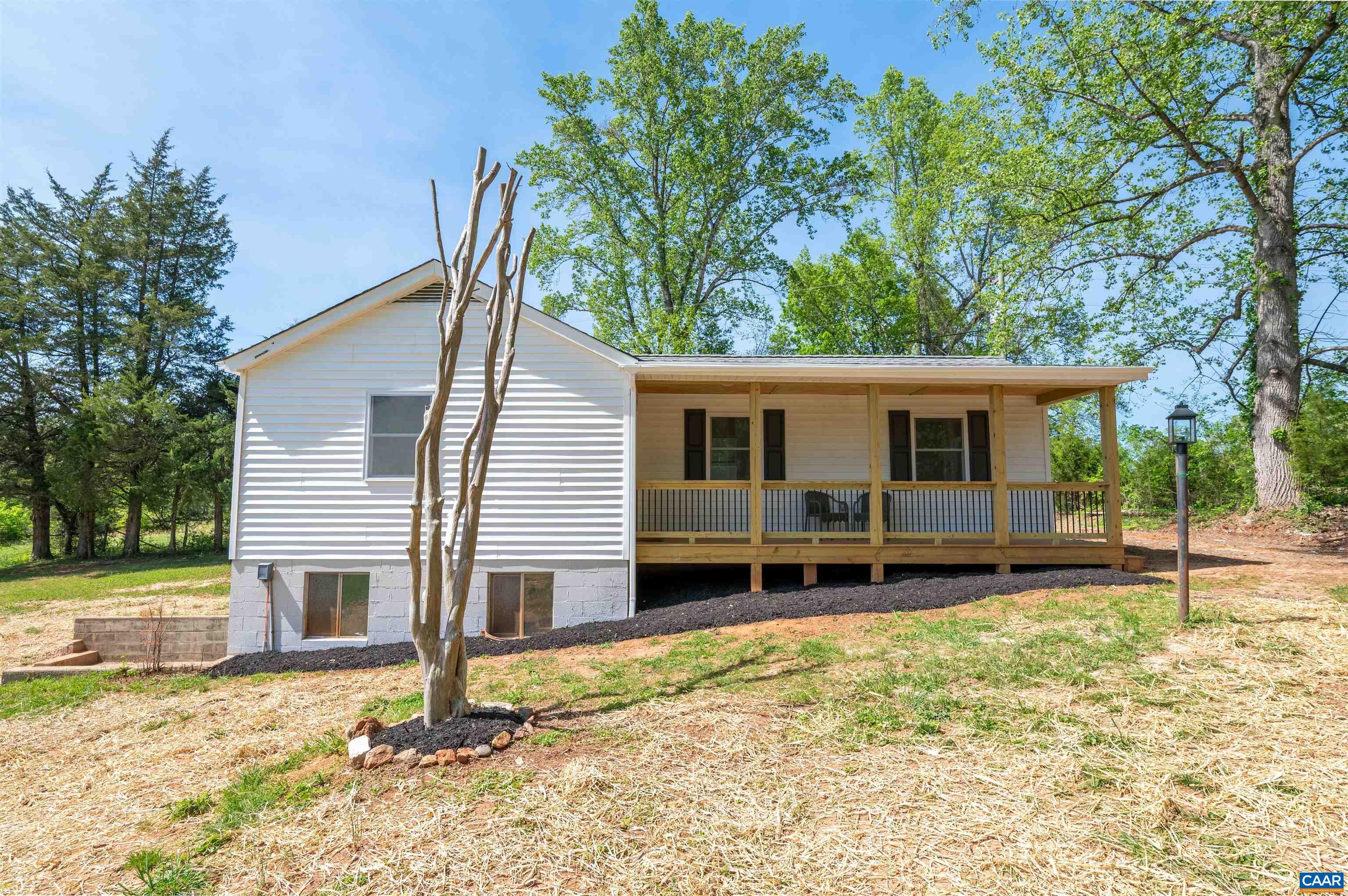 1867 Stage Junction Road Columbia, VA 23038 - Photo 6 of 46 a backyard of a house with wooden fence and a tree