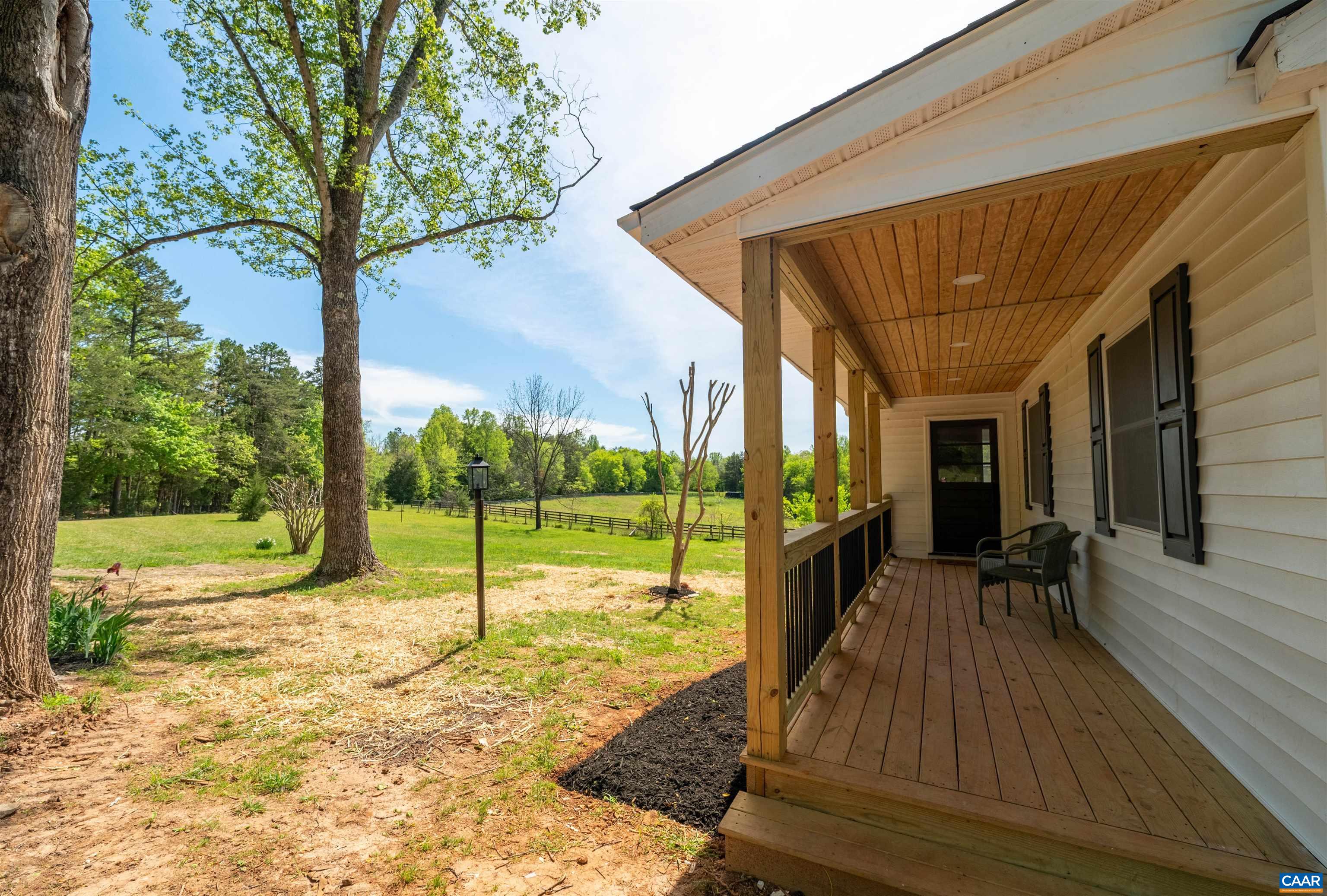 1867 Stage Junction Road Columbia, VA 23038 - Photo 10 of 46 a view of a porch with wooden floor and a yard