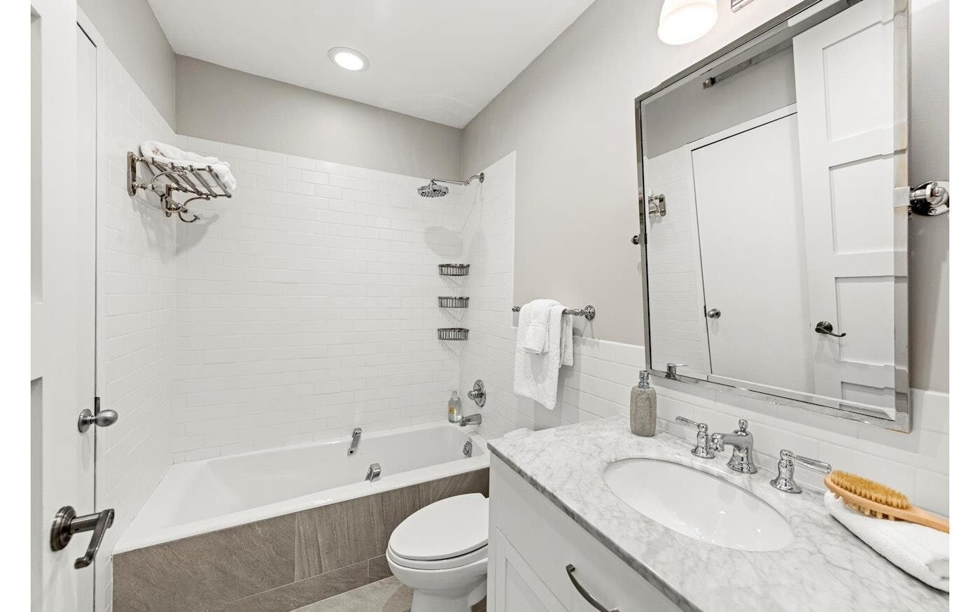 53 Murray Street, Unit 5 Manhattan, NY 10007 - Photo 10 of 11 a bathroom with a granite countertop sink a toilet and shower