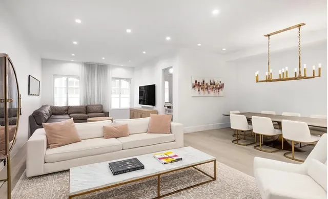 a picture of a bench in front of a white house