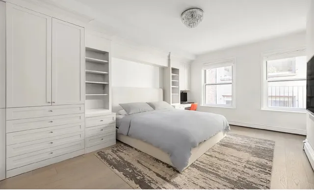 a kitchen with stainless steel appliances granite countertop a refrigerator a stove and a sink