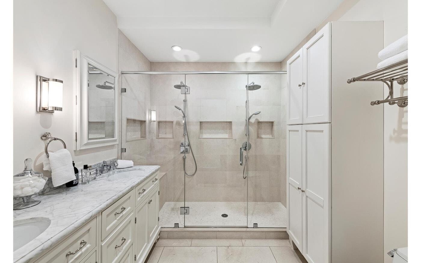 53 Murray Street, Unit 5 Manhattan, NY 10007 - Photo 6 of 11 a bathroom with a double vanity sink mirror double and shower