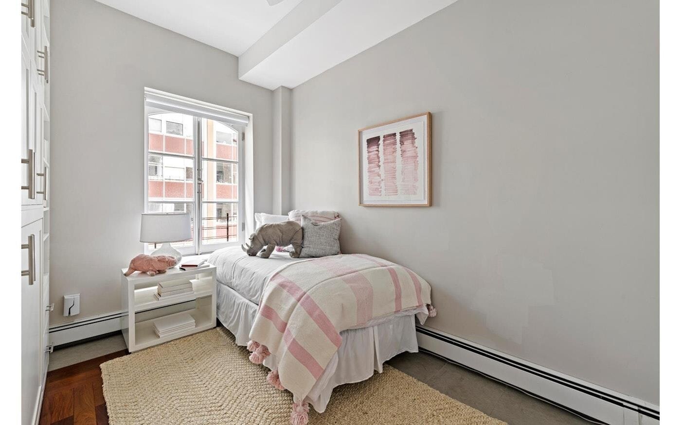53 Murray Street, Unit 5 Manhattan, NY 10007 - Photo 9 of 11 a bedroom with a bed and a window