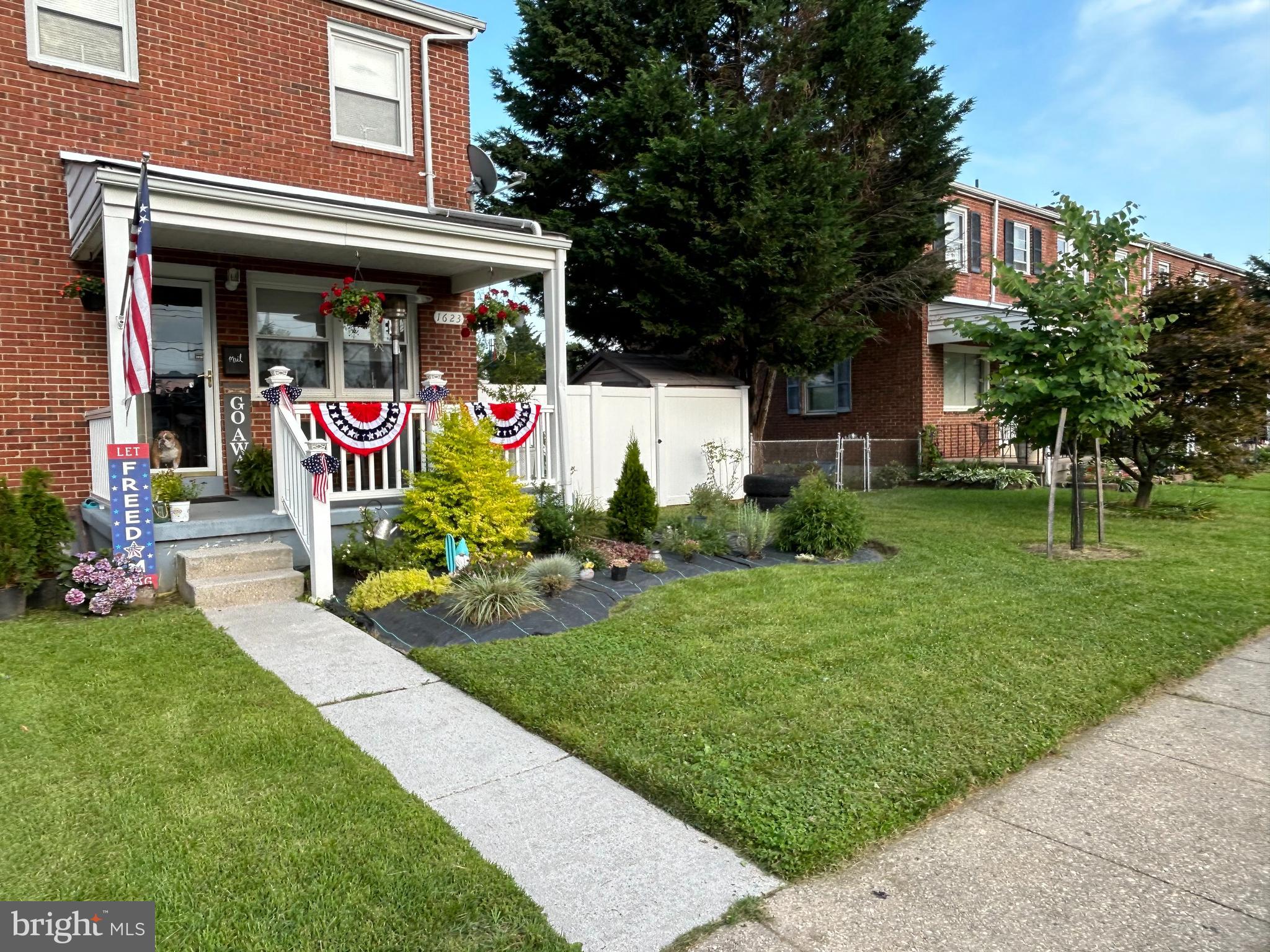 1623 Lynch Road Baltimore, MD 21222 - Photo 1 of 5 a front view of a building with garden