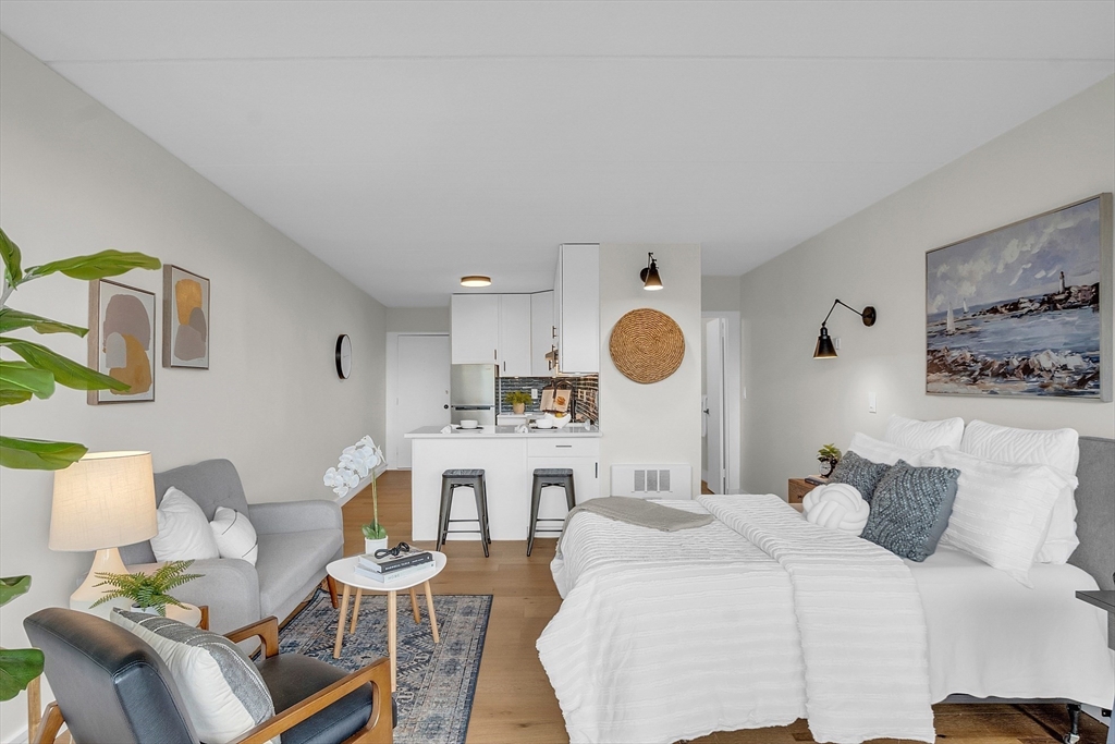 200 Swanton Street, Unit 502 Winchester, MA 01890 - Photo 11 of 24 a bed room with a bed and furniture