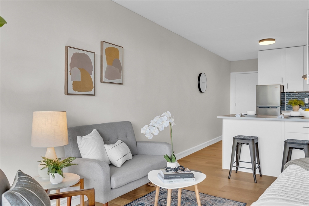 200 Swanton Street, Unit 502 Winchester, MA 01890 - Photo 15 of 24 a living room with furniture and a table