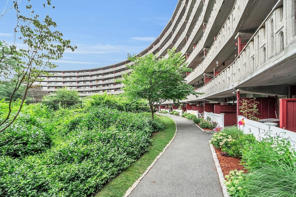 200 Swanton Street, Unit 502 Winchester, MA 01890 - Photo 19 of 24 a view of a pathway with a building in the background