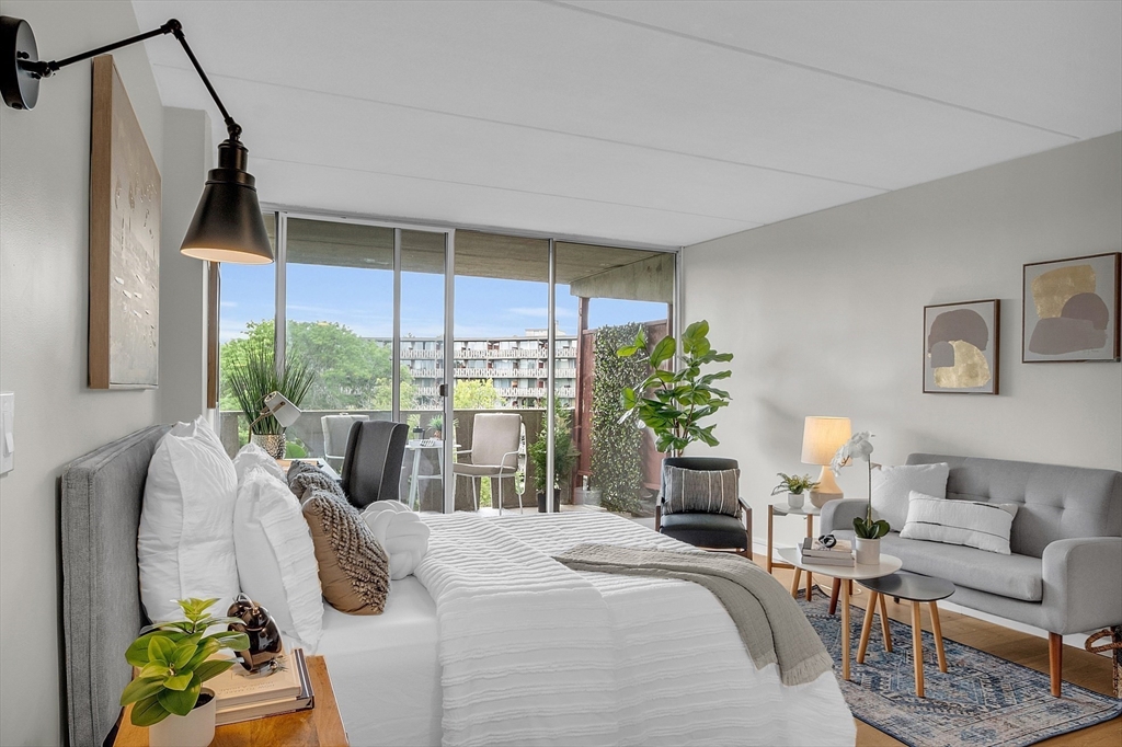 200 Swanton Street, Unit 502 Winchester, MA 01890 - Photo 8 of 24 a bedroom with furniture and a window