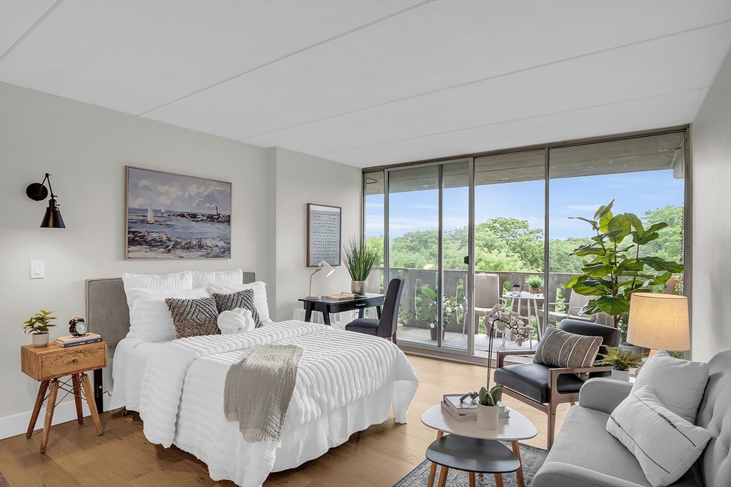 200 Swanton Street, Unit 502 Winchester, MA 01890 - Photo 9 of 24 a bedroom with a large bed and a large window