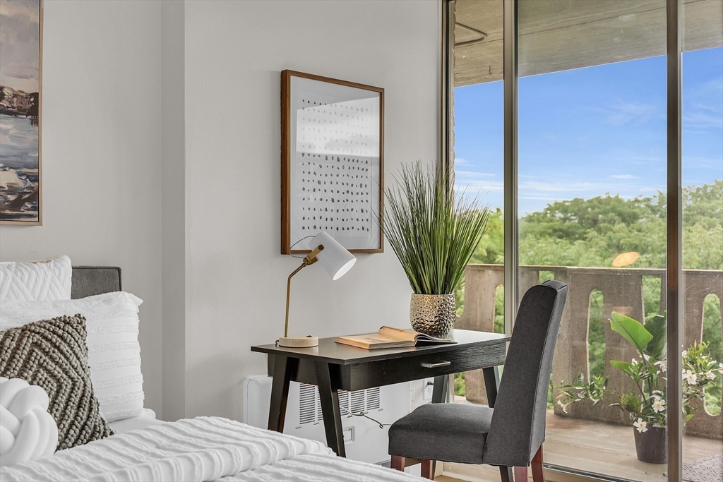 200 Swanton Street, Unit 502 Winchester, MA 01890 - Photo 10 of 24 a view of a workspace with furniture and a potted plant
