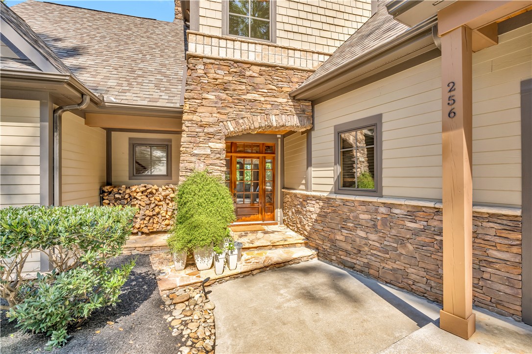 256 Talton Road Six Mile, SC 29682 - Photo 8 of 50 Natural stone accents and warm wood siding frame this inviting entry porch.