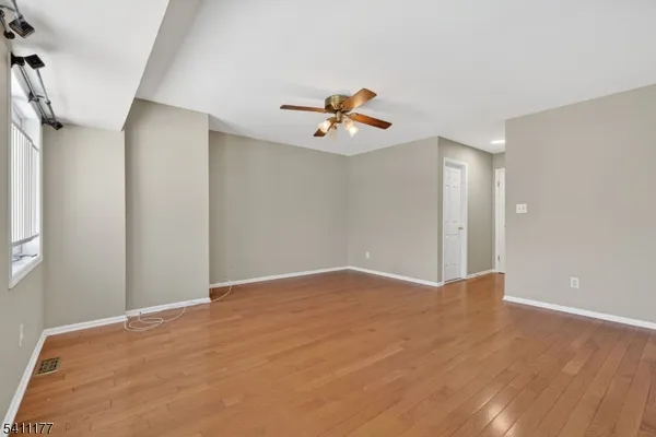 a view of a big room with carpet
