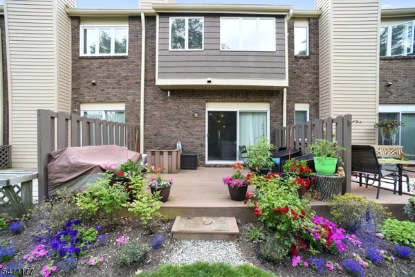 a front view of a house having outdoor seating