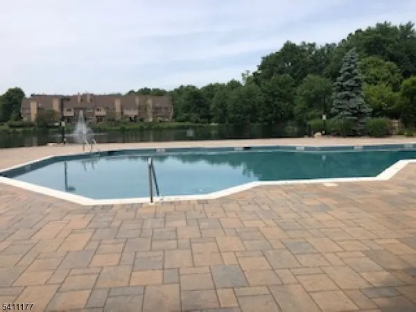 a view of a swimming pool and a yard