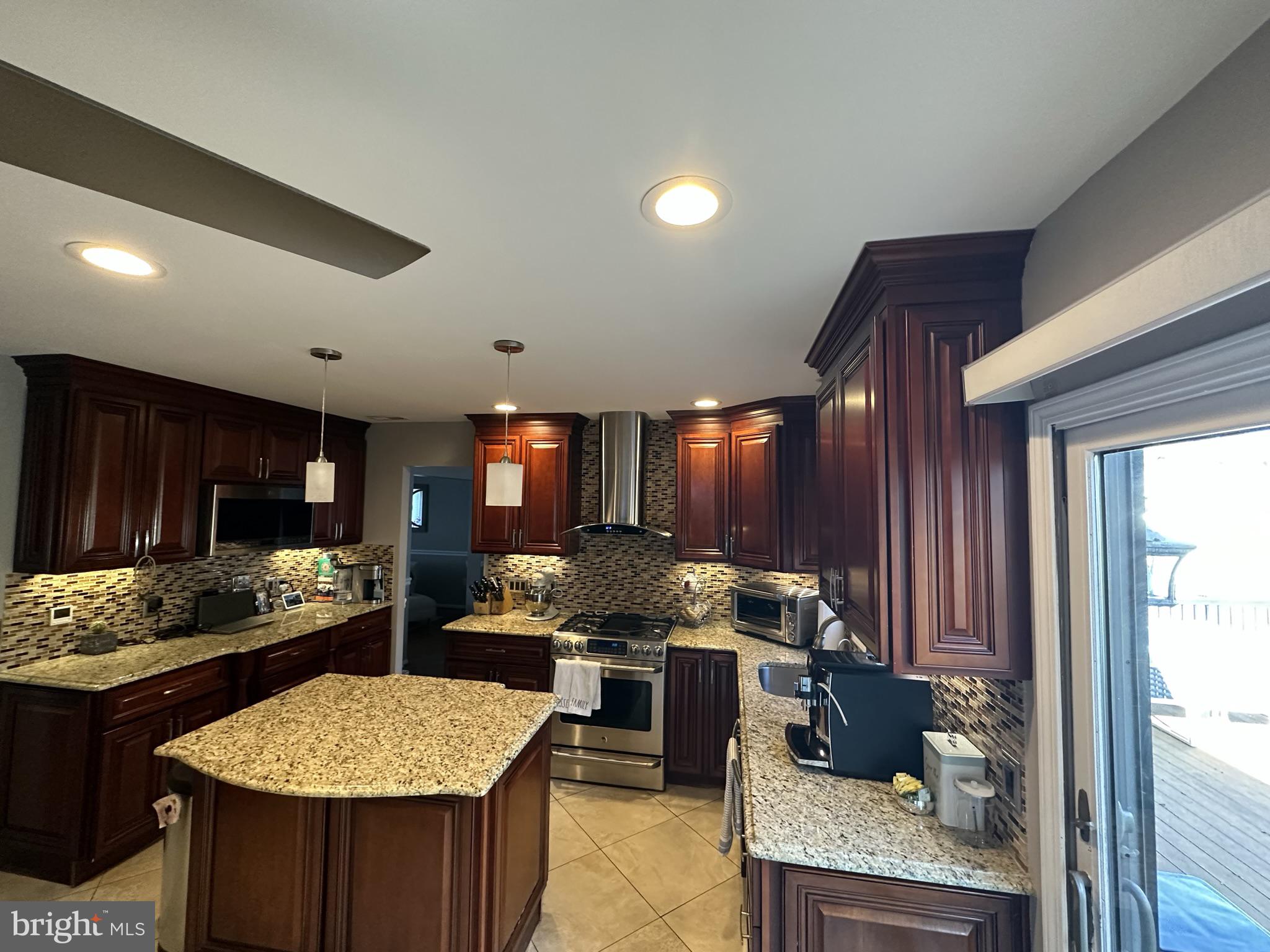 2269 Pine Road Huntingdon Valley, PA 19006 - Photo 23 of 61 a kitchen with a stove and a refrigerator