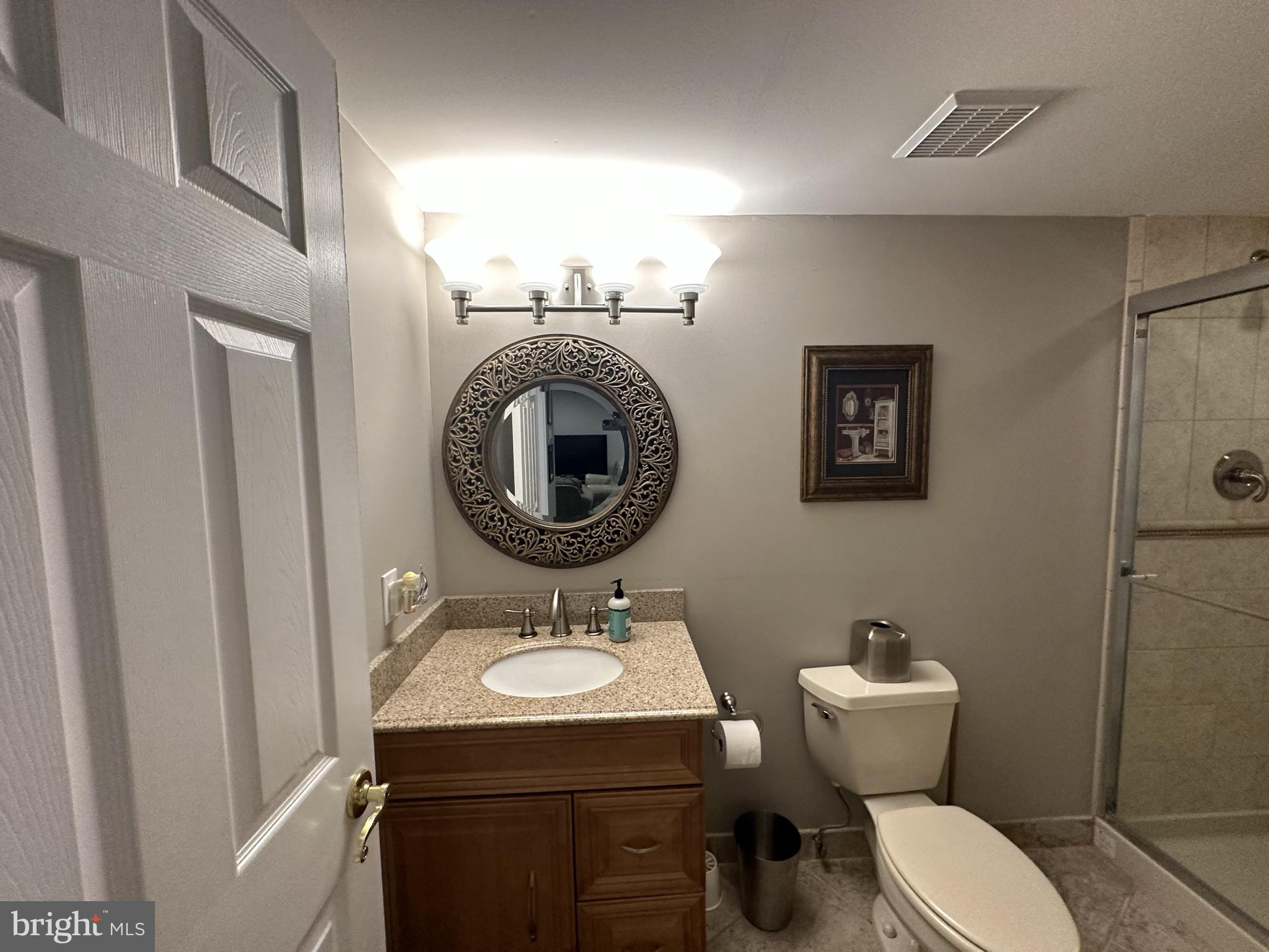 2269 Pine Road Huntingdon Valley, PA 19006 - Photo 50 of 61 a bathroom with a toilet a sink and a mirror