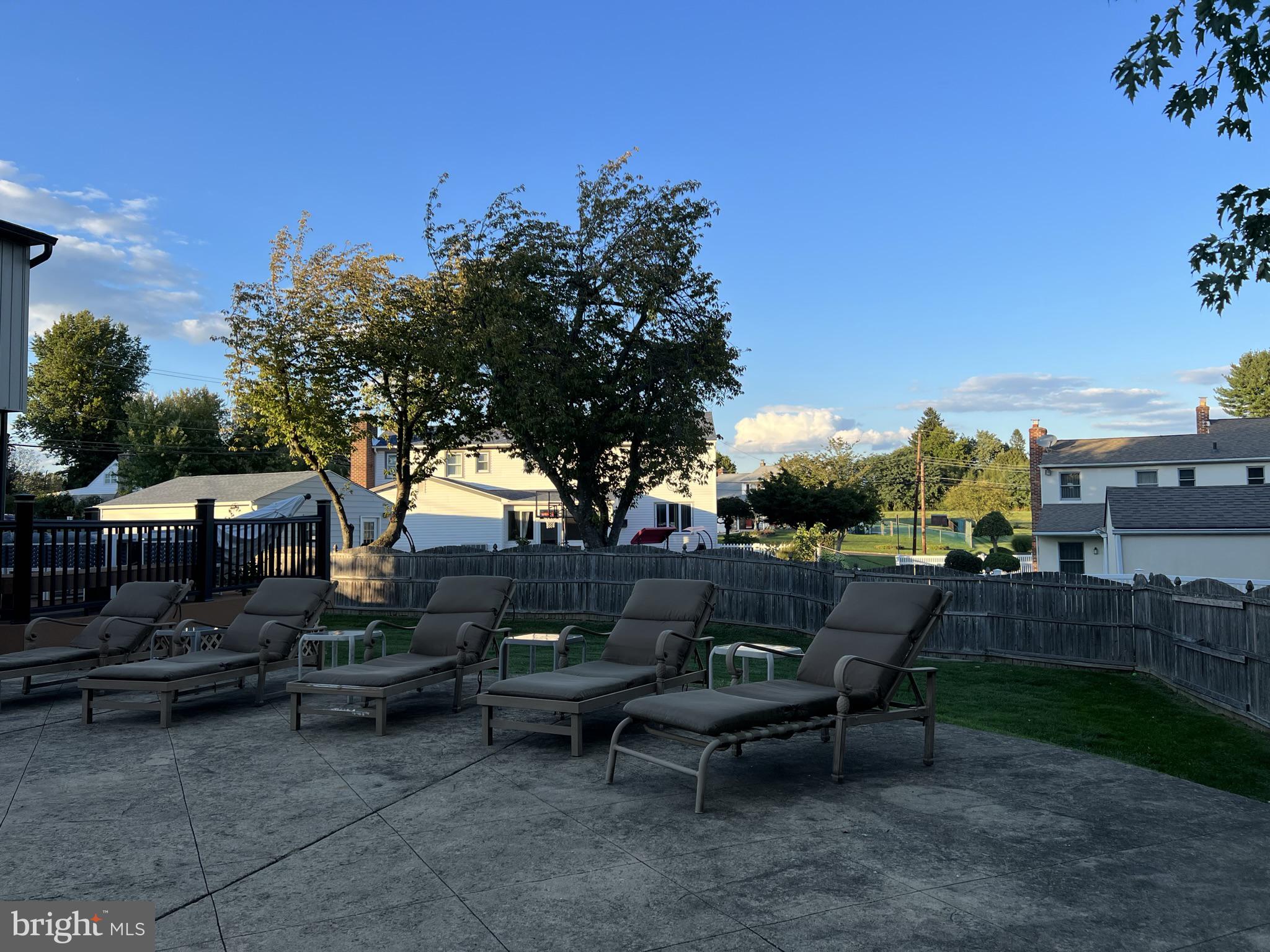 2269 Pine Road Huntingdon Valley, PA 19006 - Photo 58 of 61 a backyard of a house with table and chairs