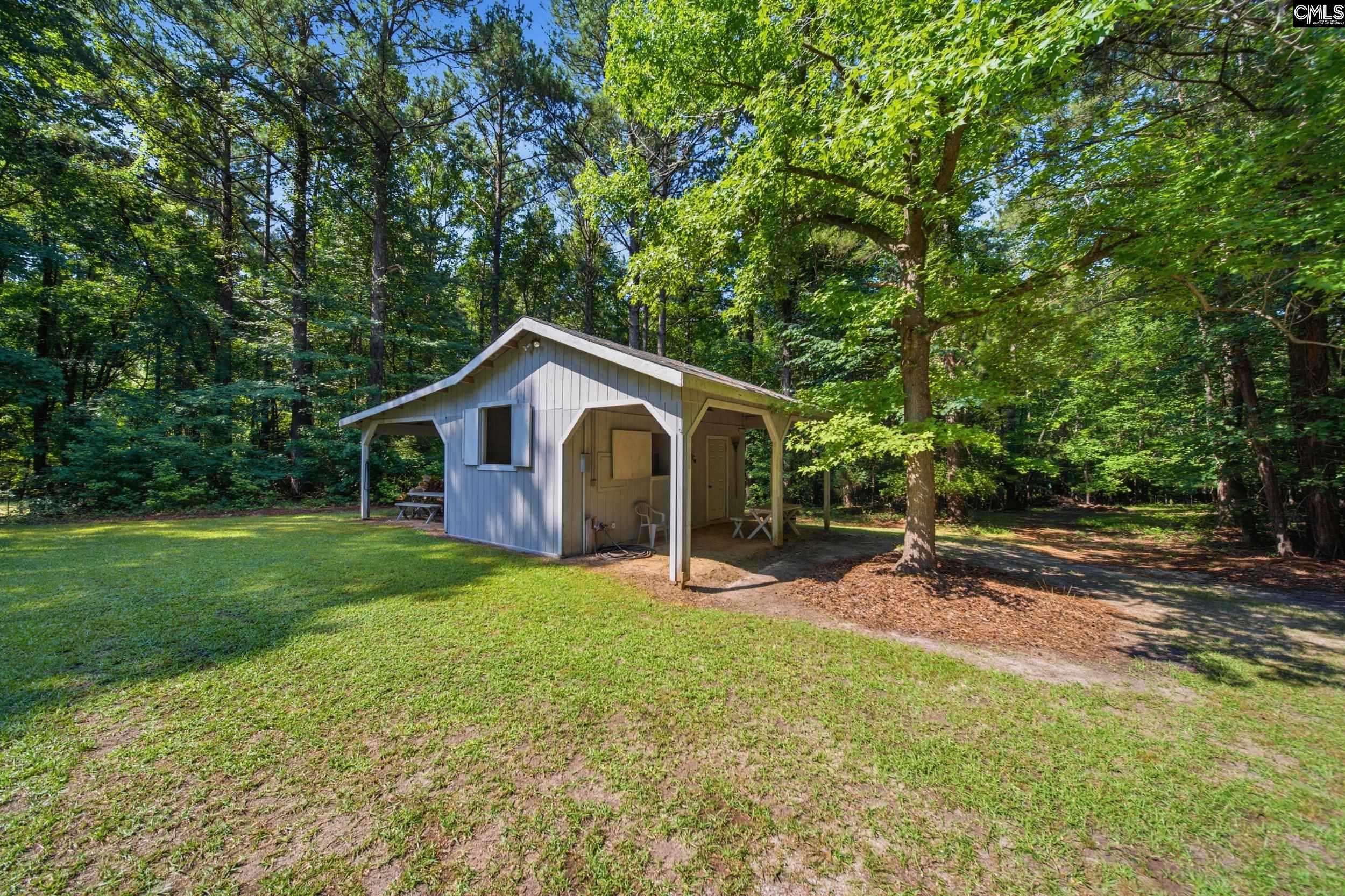 4324 Syrup Mill Road Ridgeway, SC 29130 - Photo 45 of 61 a front view of a house with yard and green space