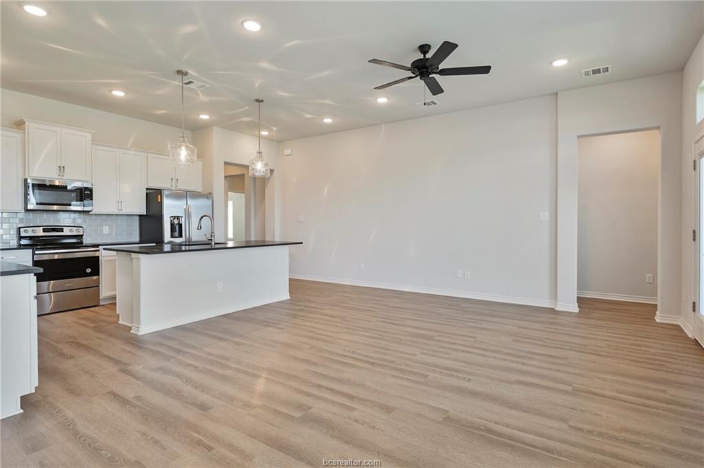 3124 Tarleton Court Bryan, TX 77808 - Photo 5 of 22 a view of kitchen with microwave and cabinets