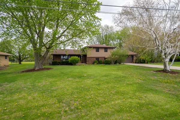 a view of a house with a yard
