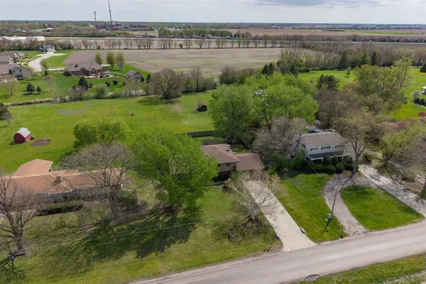 an aerial view of a house with outdoor space