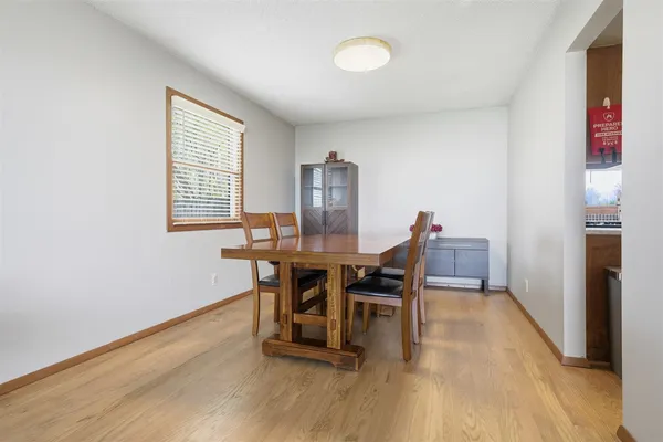 a view of a kitchen cabinets and a wooden floor