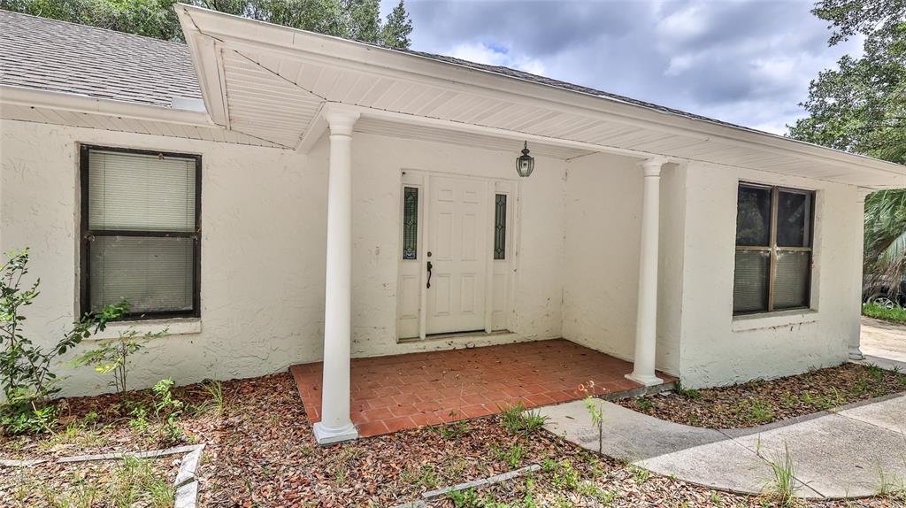 3085 Howland Boulevard Deltona, FL 32725 - Photo 3 of 14 a view of a wooden door