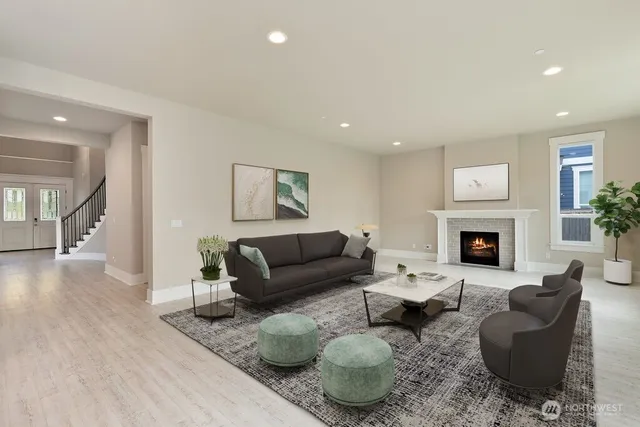 an empty room with wooden floor and fireplace