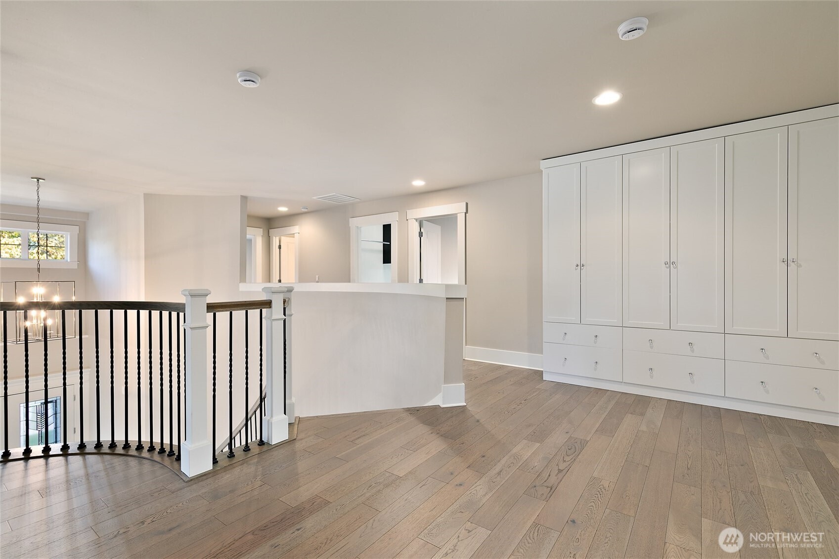 11575 Southeast 81st Street Newcastle, WA 98056 - Photo 19 of 40 an empty room with wooden floor and windows