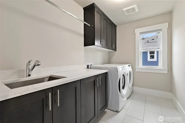 a spacious bedroom with a large bed and a chandelier