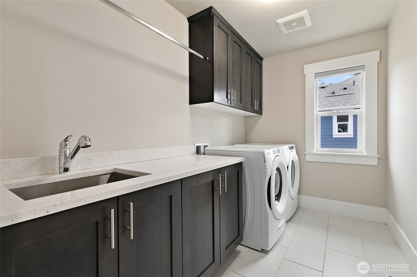 11575 Southeast 81st Street Newcastle, WA 98056 - Photo 24 of 40 a utility room with a sink a washer and dryer