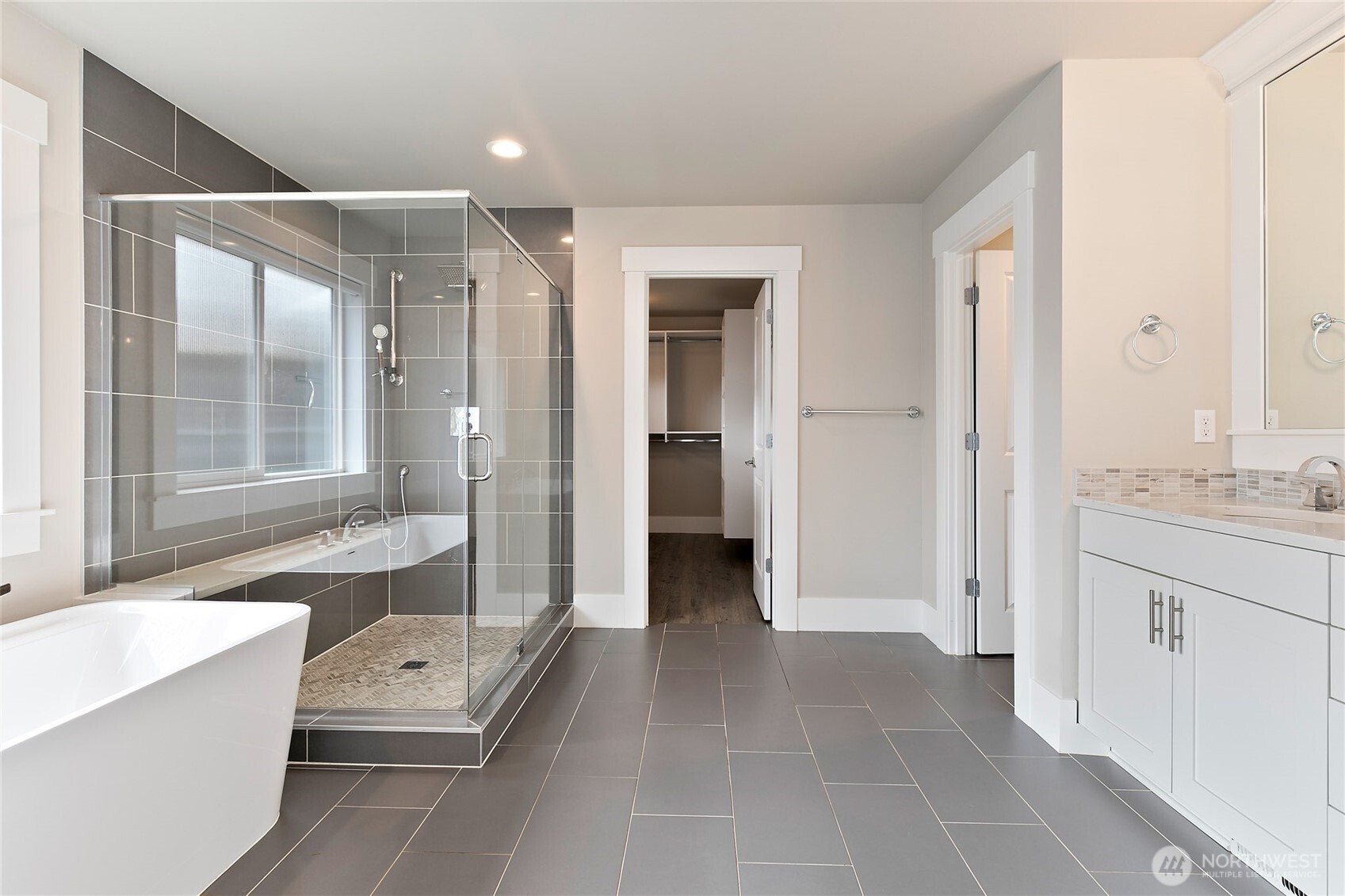 11575 Southeast 81st Street Newcastle, WA 98056 - Photo 29 of 40 a bathroom with a sink a mirror and a bathtub
