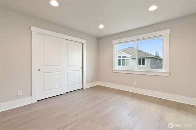 a bathroom with a double vanity sink a mirror and shower