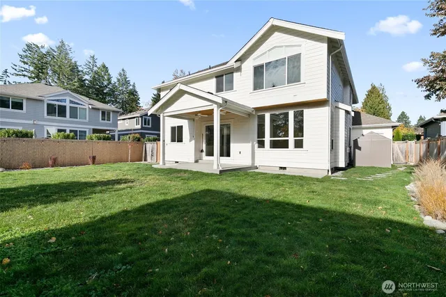 an aerial view of a house with a yard and plants