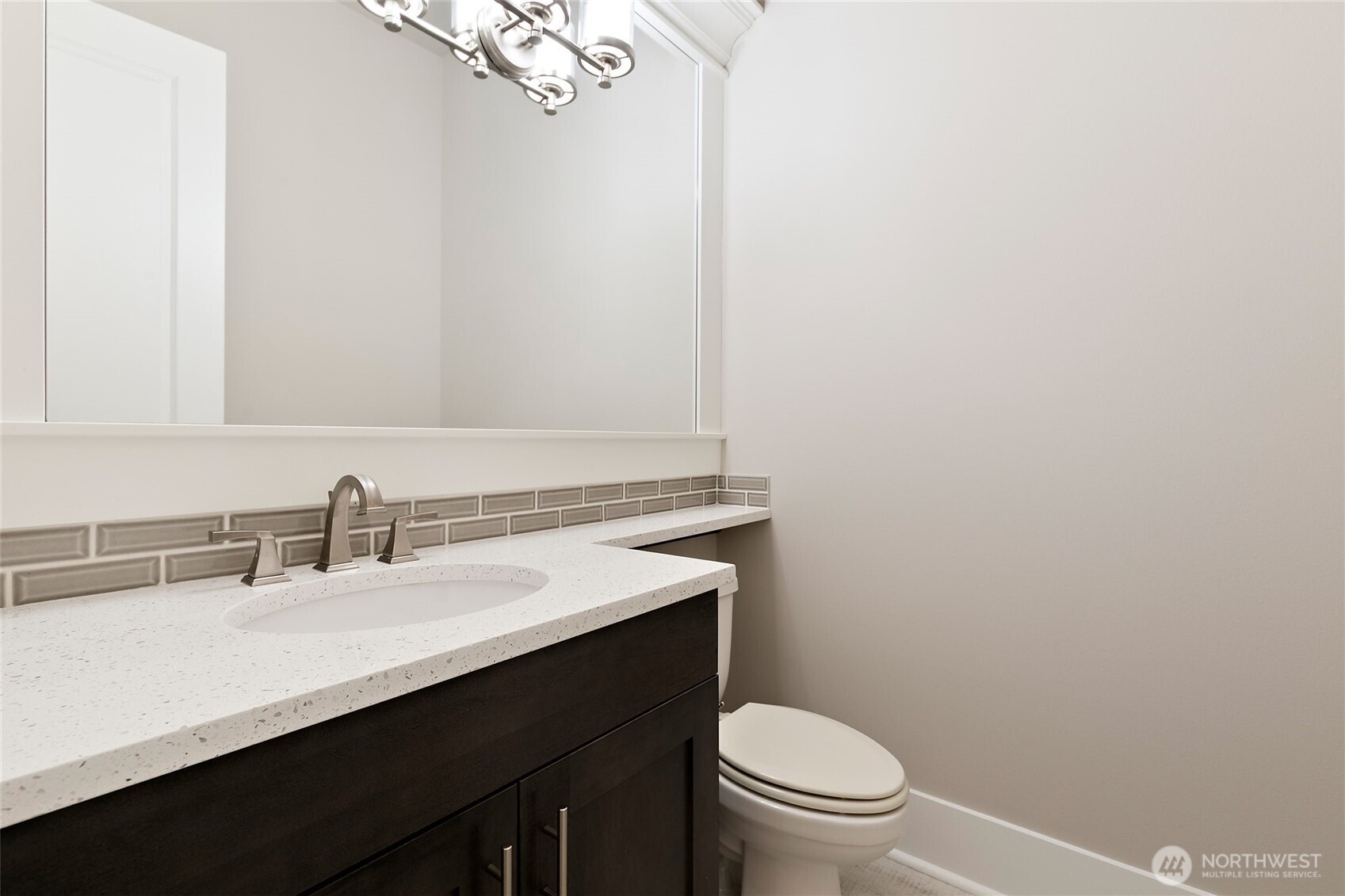 11575 Southeast 81st Street Newcastle, WA 98056 - Photo 4 of 40 a bathroom with a sink a toilet and a mirror