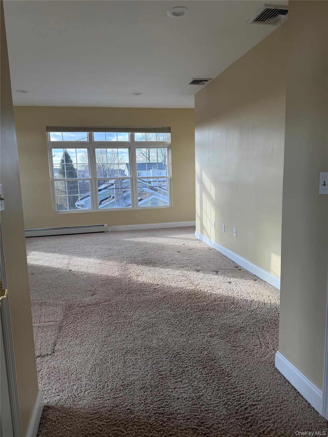 72 North Fordham Road Hicksville, NY 11801 - Photo 19 of 27 a view of an empty room with a window