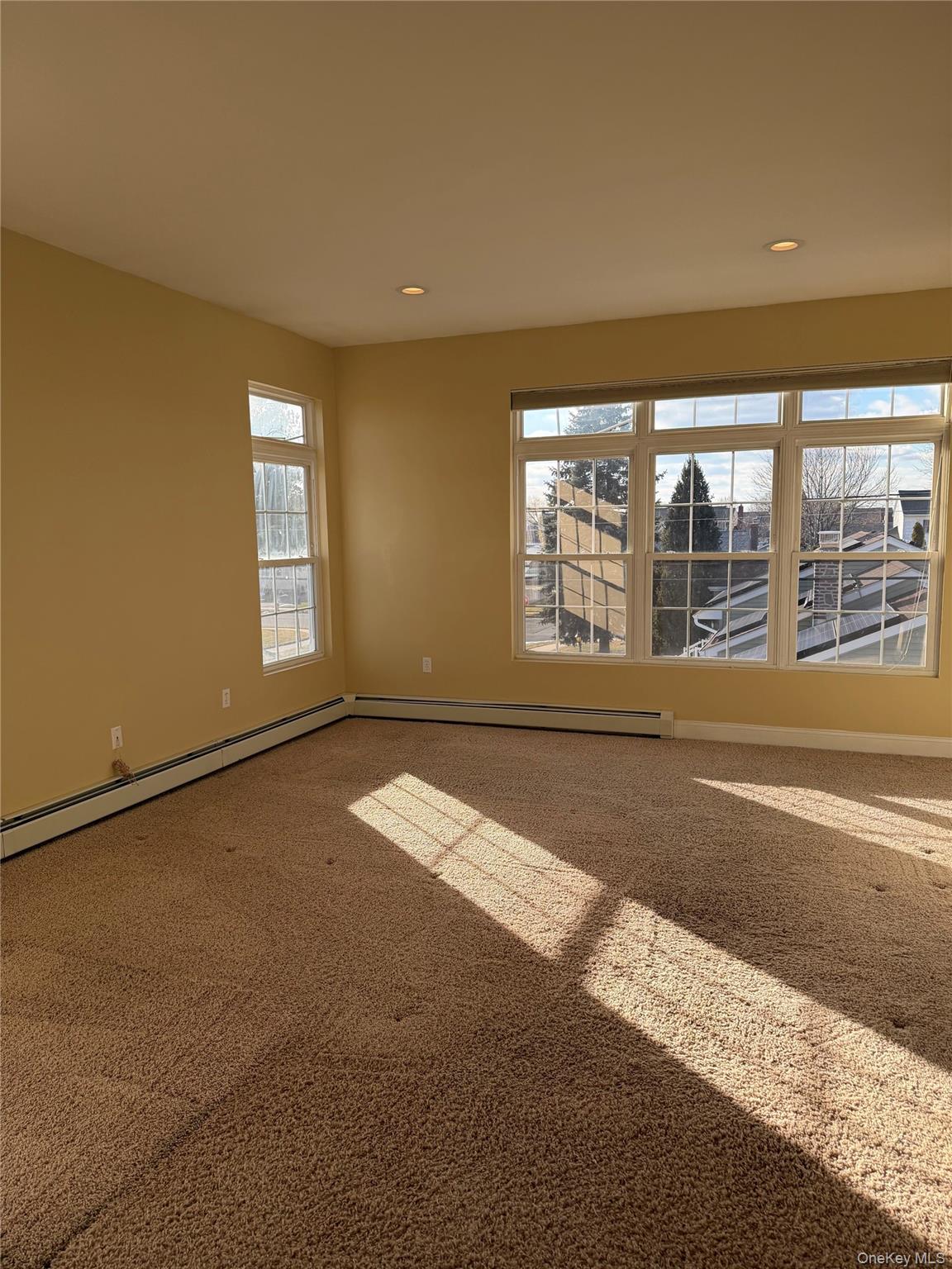 72 North Fordham Road Hicksville, NY 11801 - Photo 20 of 27 a view of an empty room with a window