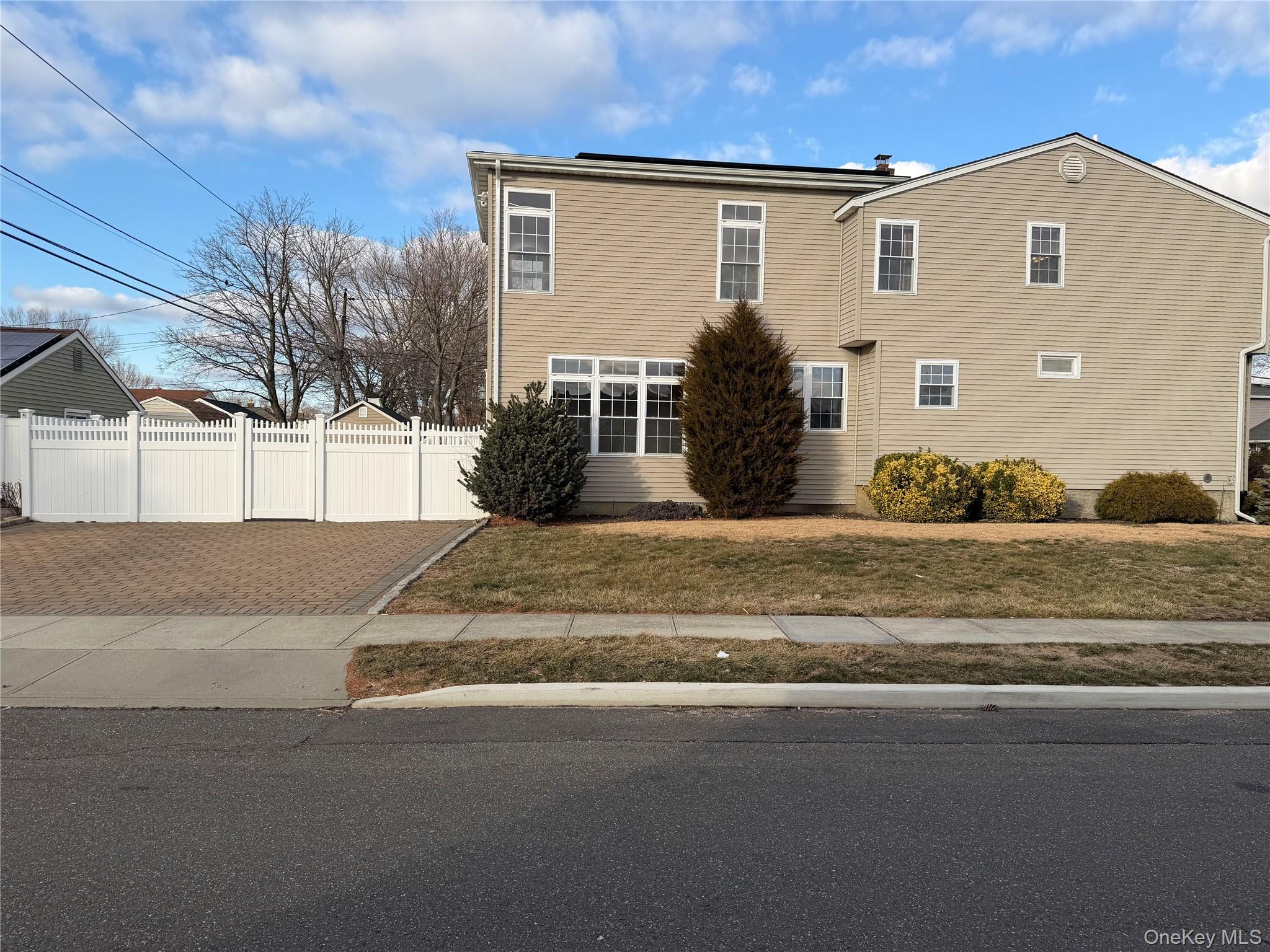 72 North Fordham Road Hicksville, NY 11801 - Photo 2 of 27 a front view of a house with a yard
