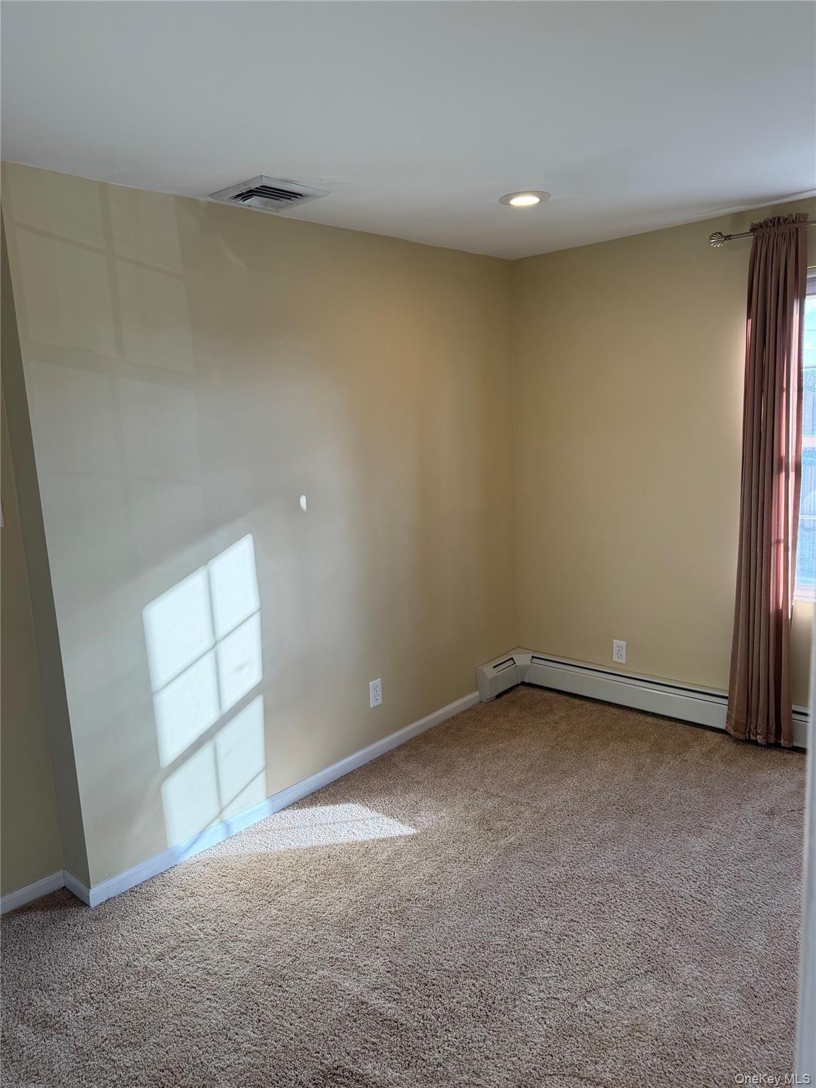 72 North Fordham Road Hicksville, NY 11801 - Photo 23 of 27 an empty room with a empty space and window