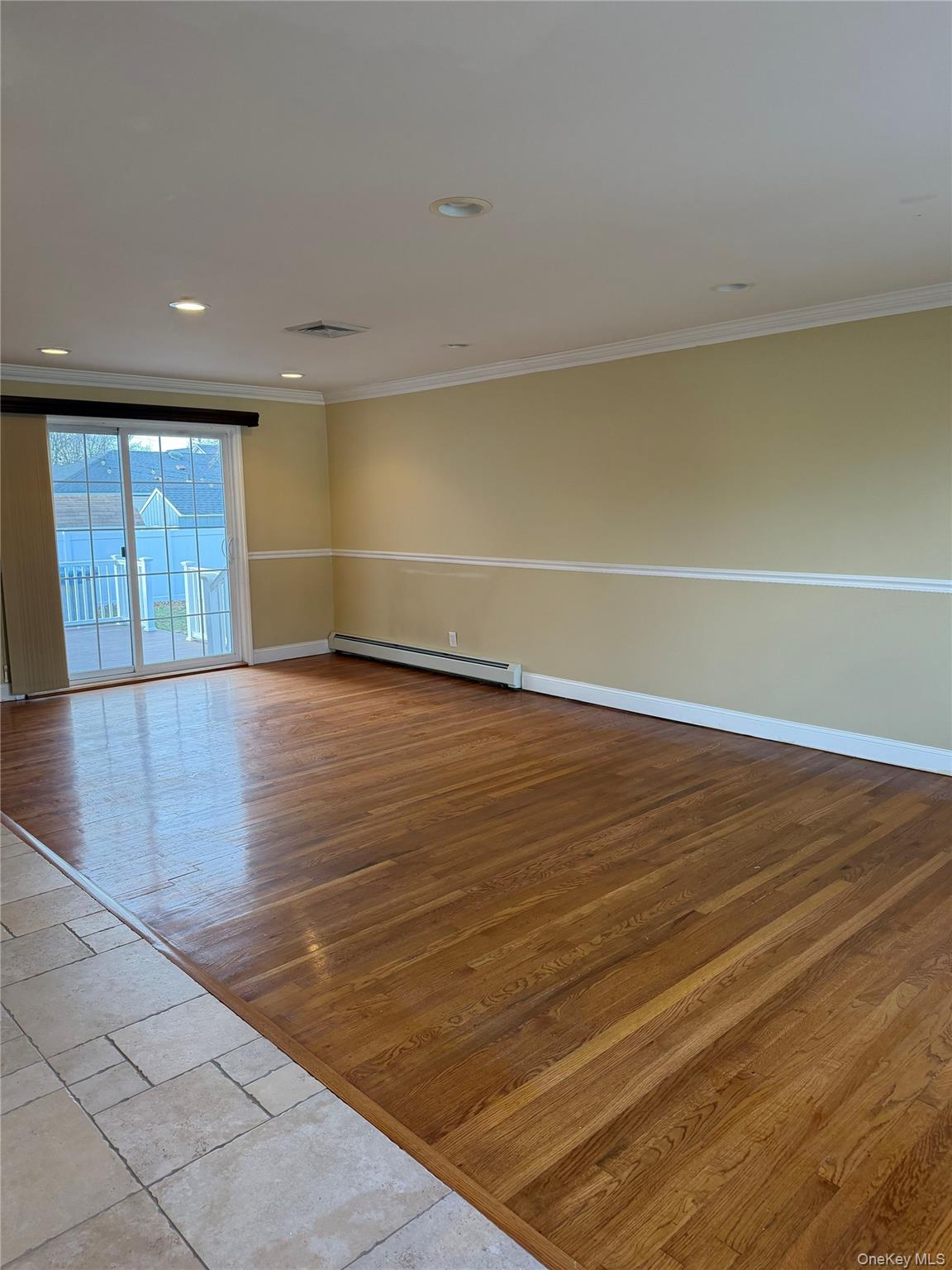 72 North Fordham Road Hicksville, NY 11801 - Photo 3 of 27 a view of empty room with wooden floor