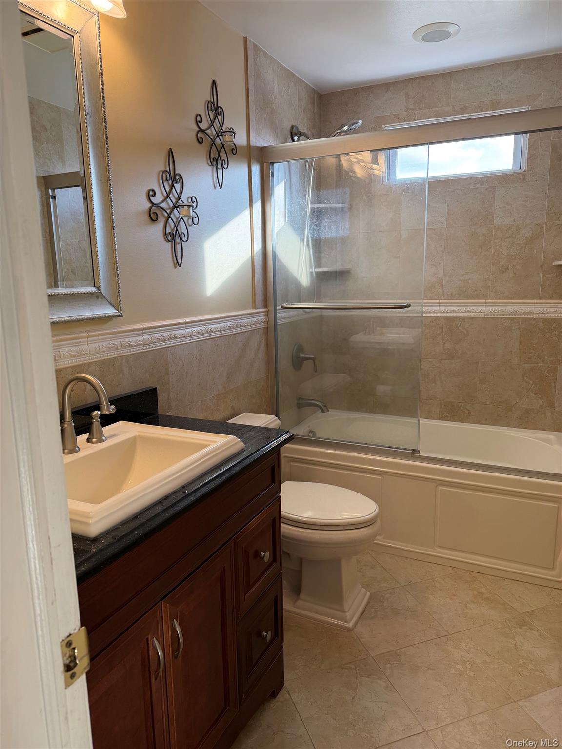 72 North Fordham Road Hicksville, NY 11801 - Photo 8 of 27 a bathroom with a sink a toilet and shower