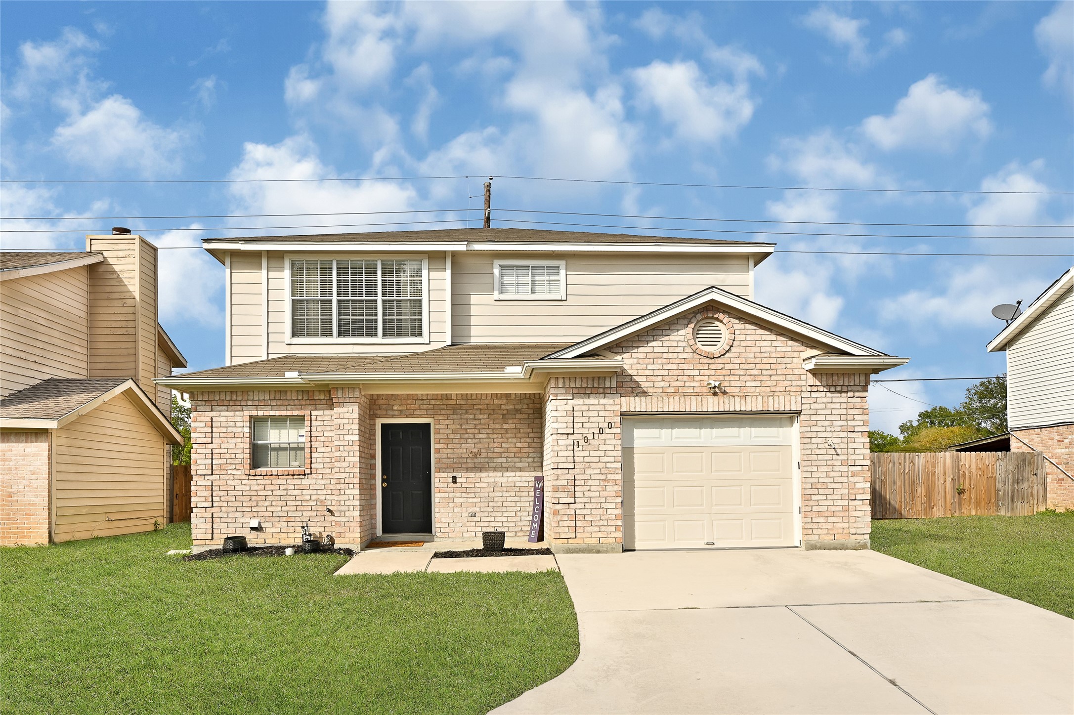 10100 Spring Pl Drive Houston, TX 77070 - Photo 2 of 24 Welcoming exterior view showcasing the home’s inviting entry and clean facade.