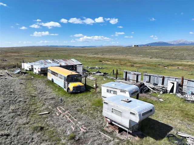 a view of a swimming pool with a yard