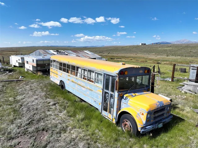 an aerial view of a house with outdoor space