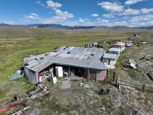 an aerial view of a house with a ocean view