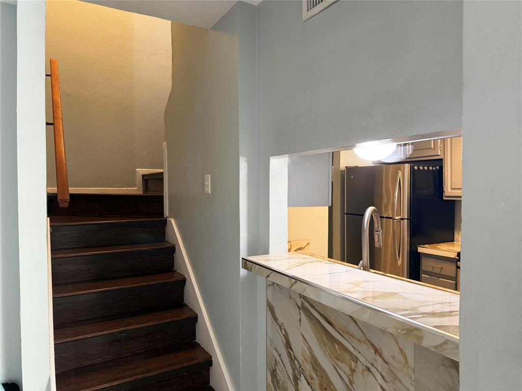 11311 Audelia Road, Unit 161 Dallas, TX 75243 - Photo 5 of 15 a view of a kitchen from the hallway