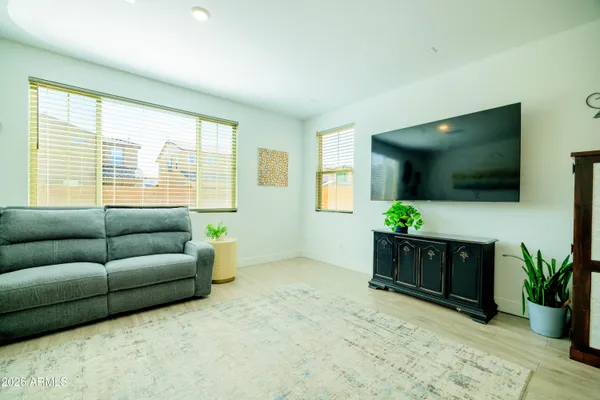 a bedroom with a bed and flat screen tv