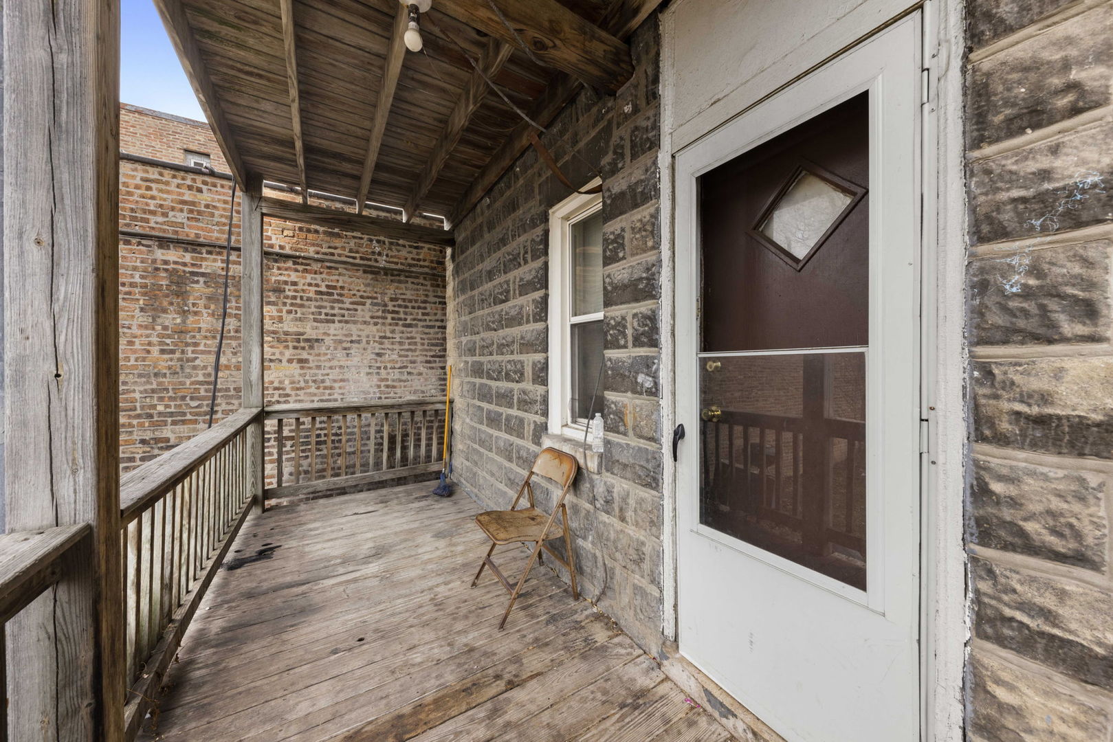 910 St Charles Road Maywood, IL 60153 - Photo 2 of 13 a view of entryway with wooden floor