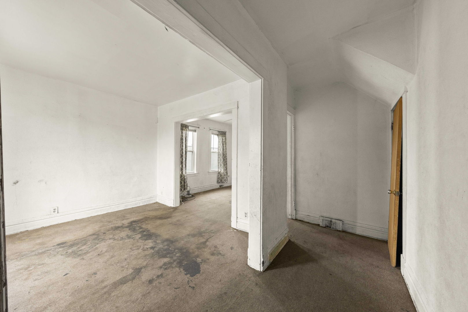 910 St Charles Road Maywood, IL 60153 - Photo 6 of 13 an empty room with windows